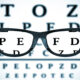 Eye Chart or Sight Test Seen Through Eye Glasses on a white background. 3d Rendering
